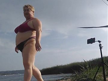 Mother-in-law sucks my dick on the beach and gets cum in her mouth