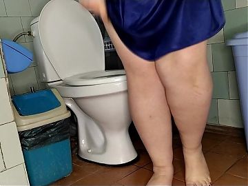 Chubby wife pissing on the toilet